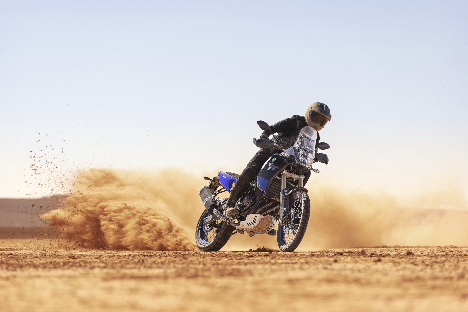 Man Riding A Motorcycle In Sand — Motorcycle Dealer in Berrimah, NT