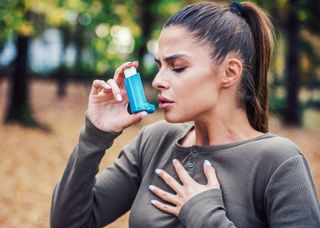 Young Woman Treating Asthma With Inhaler — Hickory, NC — Hickory Allergy and Asthma Clinic PA