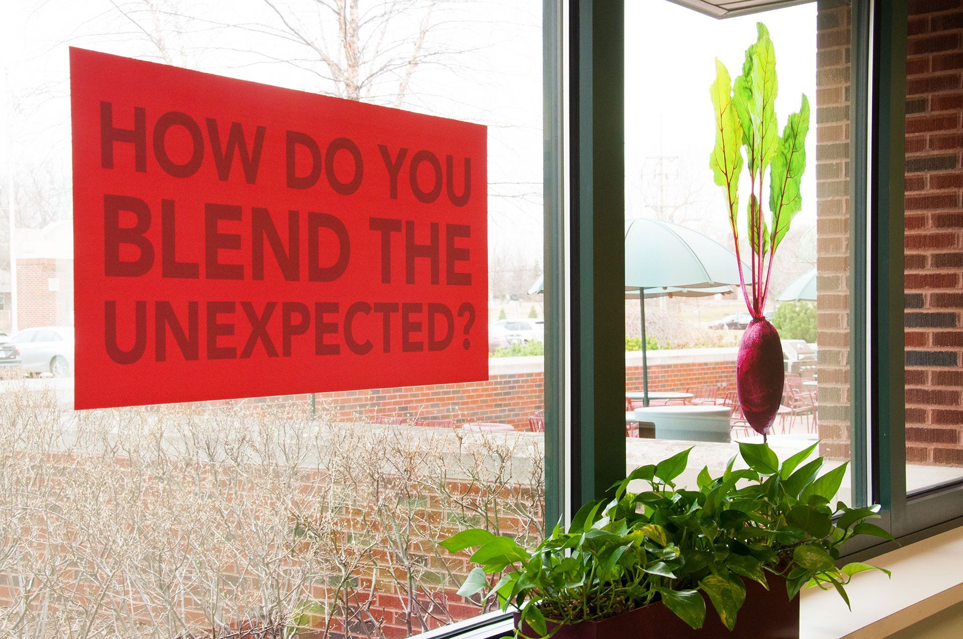 A sign in a window asks how do you blend the unexpected