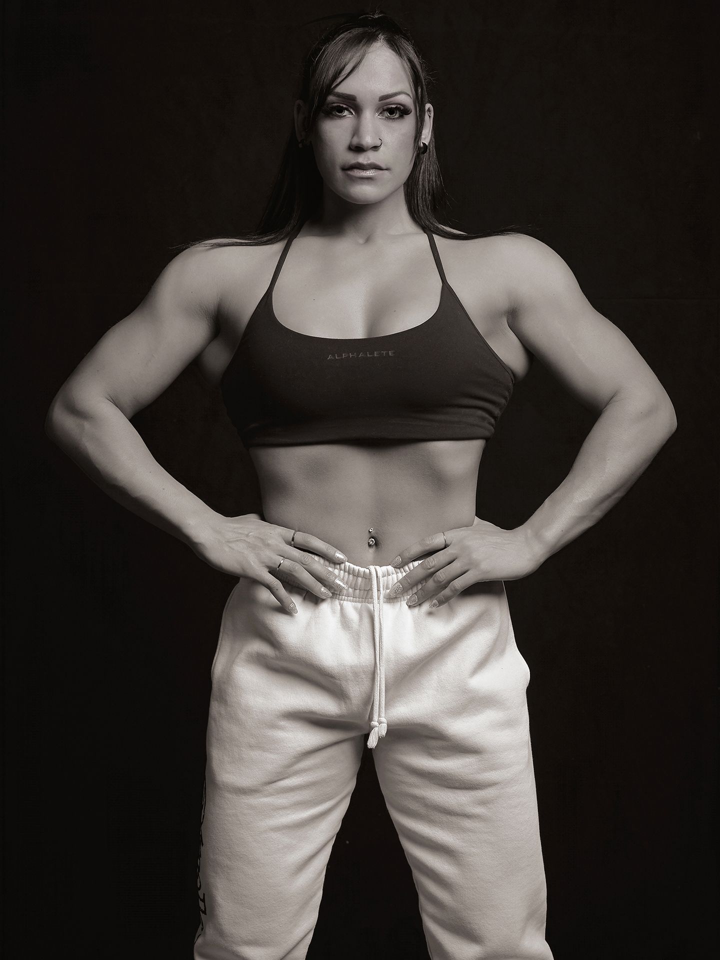 A woman is standing with her hands on her hips