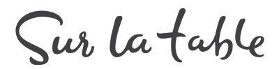 The word sur la table is written in cursive on a white background.