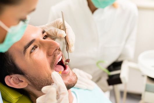 Man Doing a Dental Checkup