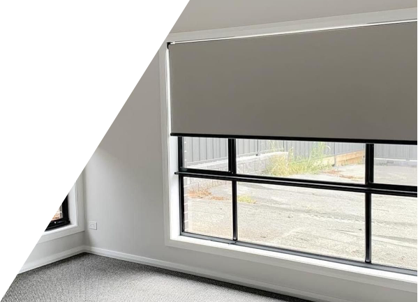 A white wall with a window with black blinds on it