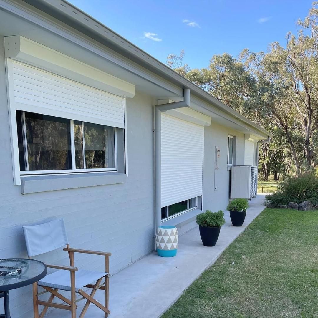 A house with a chair and a table in front of it