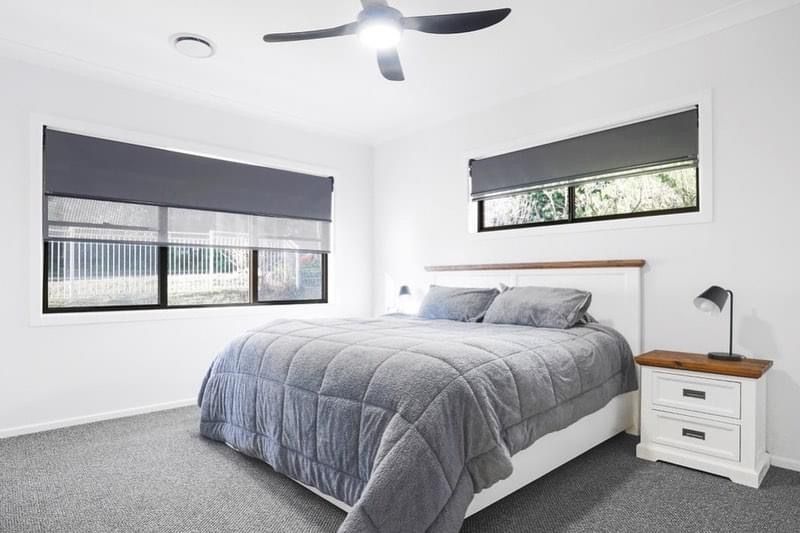 White blinds on a window with a white frame