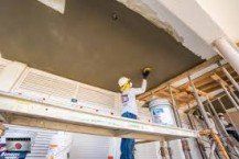 Man Applying Cement on the Ceiling | Chicago, IL | Turek & Sons