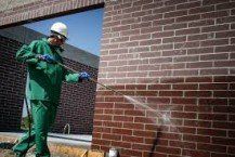 Man Cleaning Wall | Chicago, IL | Turek & Sons