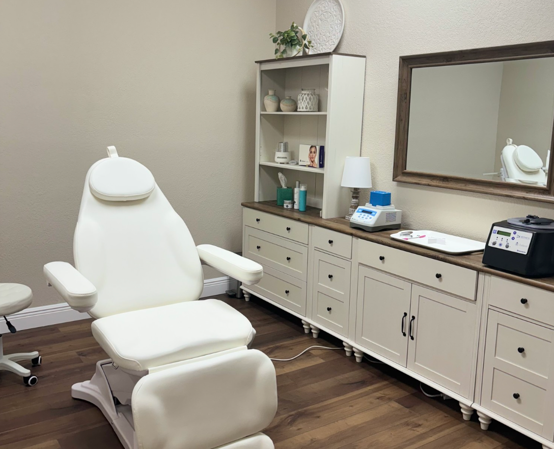 A woman is peeling off a mask from her face.