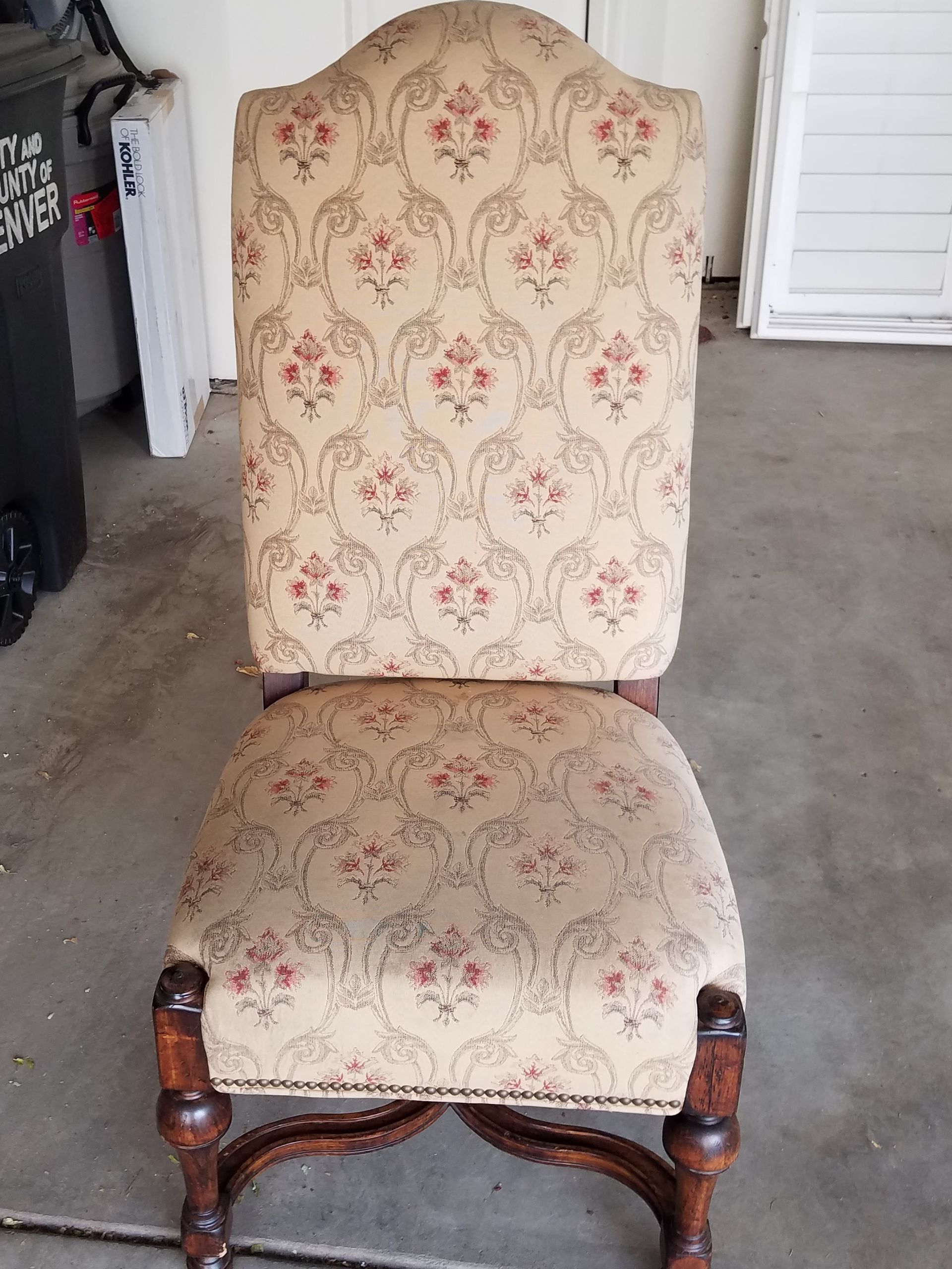 A chair with a floral pattern cover