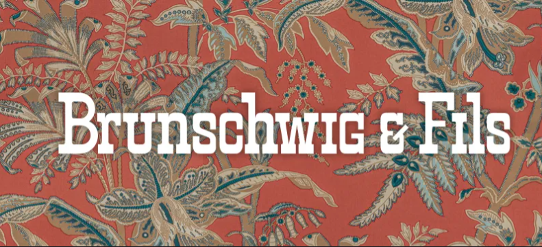 A banner for brunschwig & fils with a floral pattern