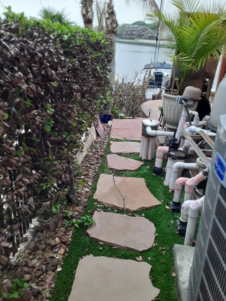 A walkway with a lot of pipes on it