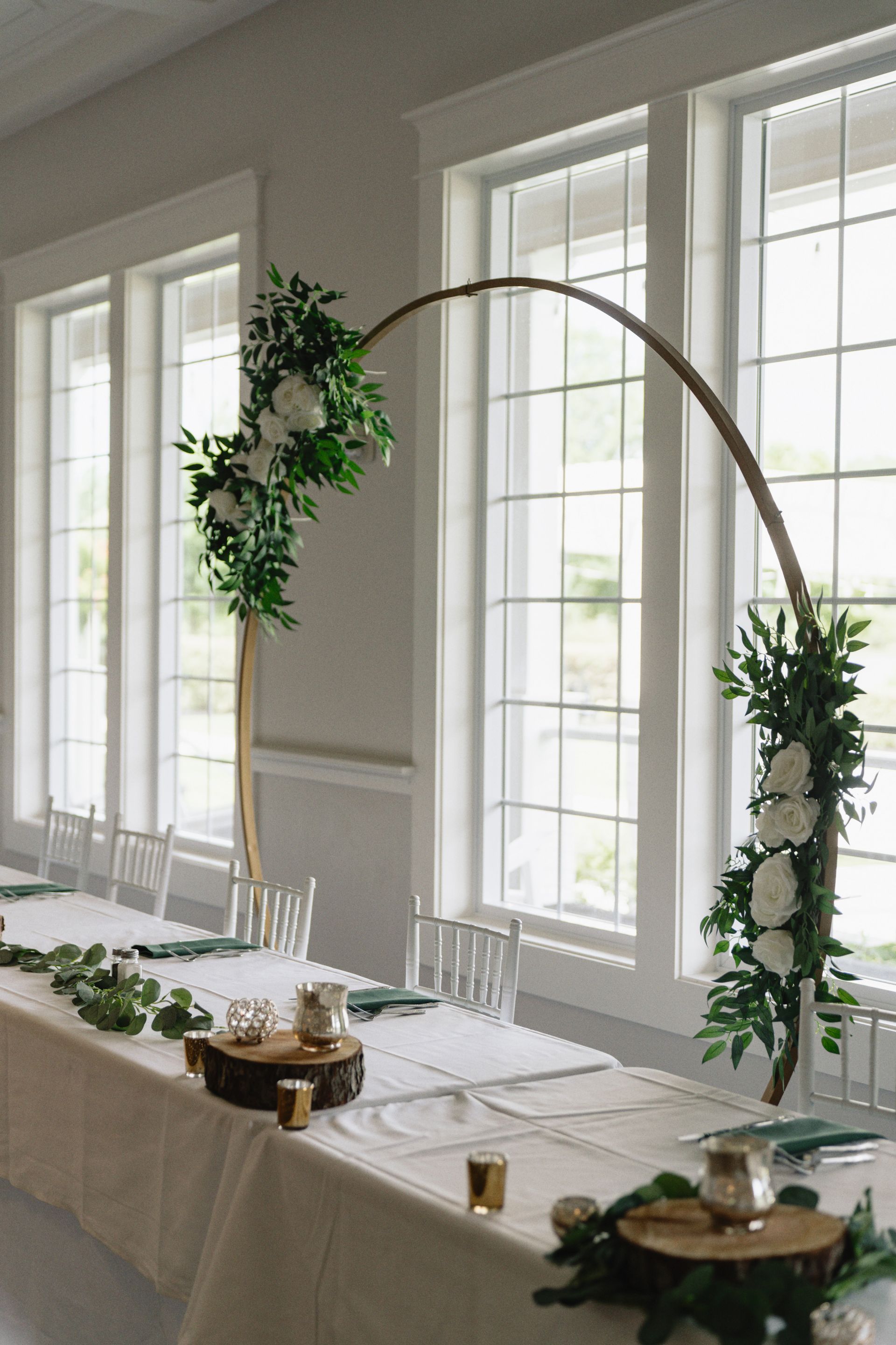 A table is decorated with flowers for a wedding.