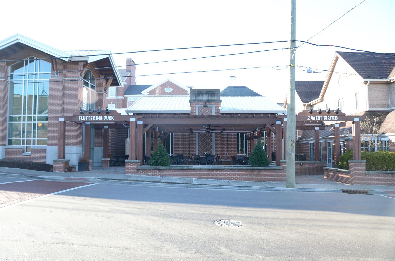 A brick building with a sign that says ' butterfly ' on it