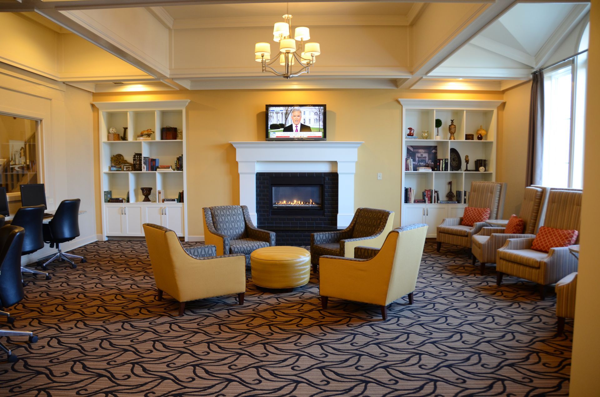 A living room filled with furniture and a fireplace.