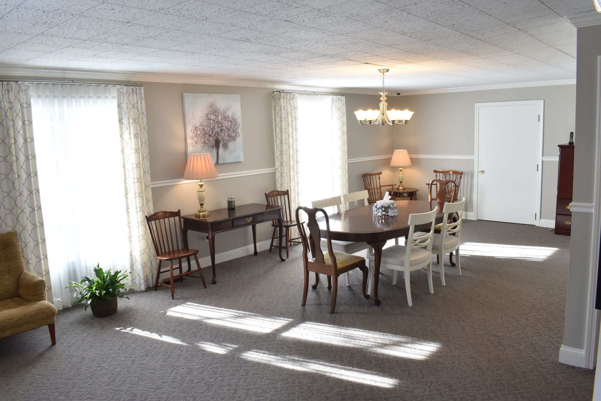 A large room with a table and chairs in it