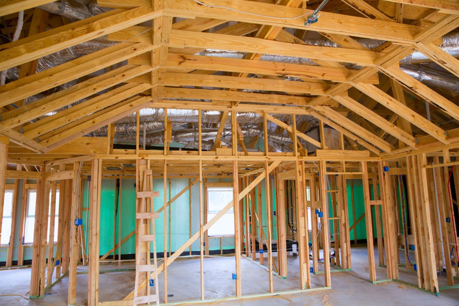 A house is being built with a lot of wooden beams.