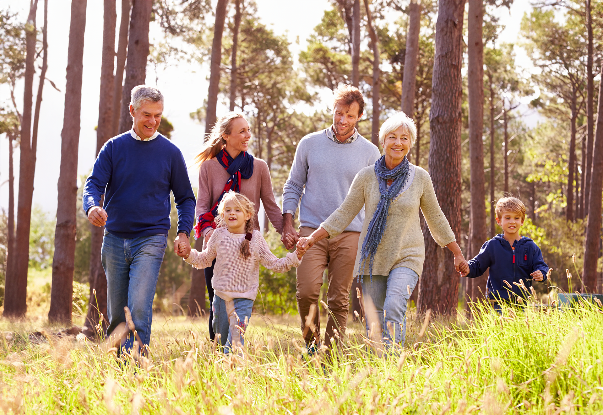 A group of people are posing for a picture together and smiling.