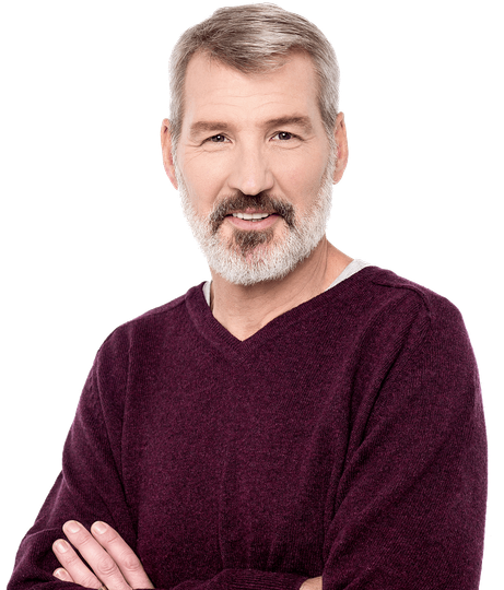 Mature man with crossed arms, smiling. Gray hair and beard, wearing a maroon sweater.