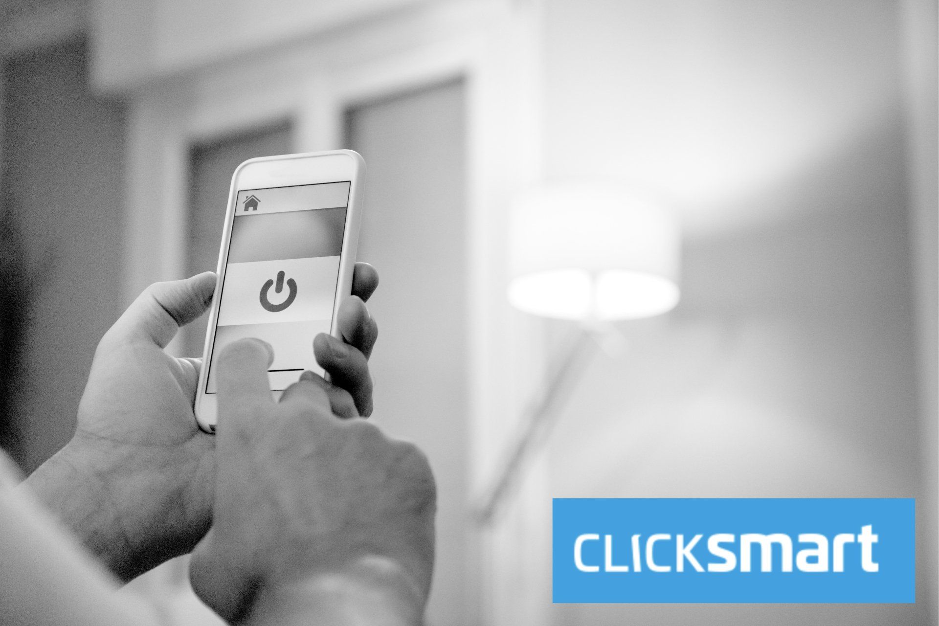 A black and white photo of a person using a smart phone