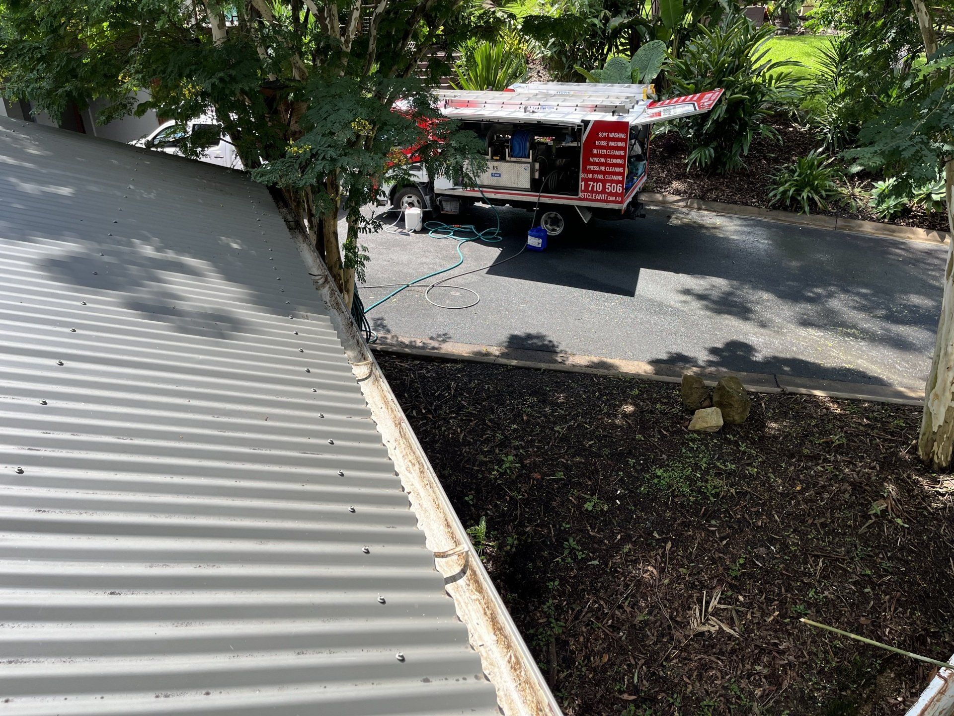 Gutters Being Cleaned — Jackson’s Window Cleaning in Nerang, QLD
