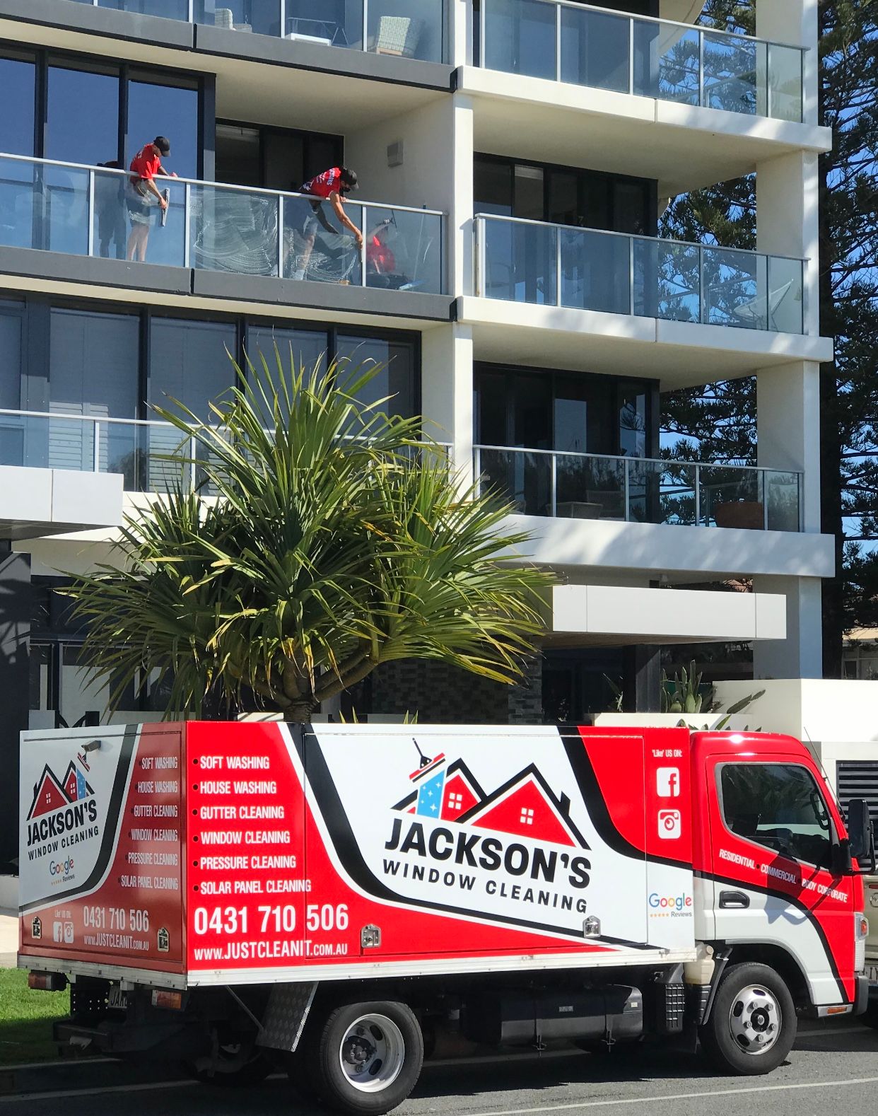 Man Cleaning interior windows — Jackson’s Window Cleaning in Nerang, QLD