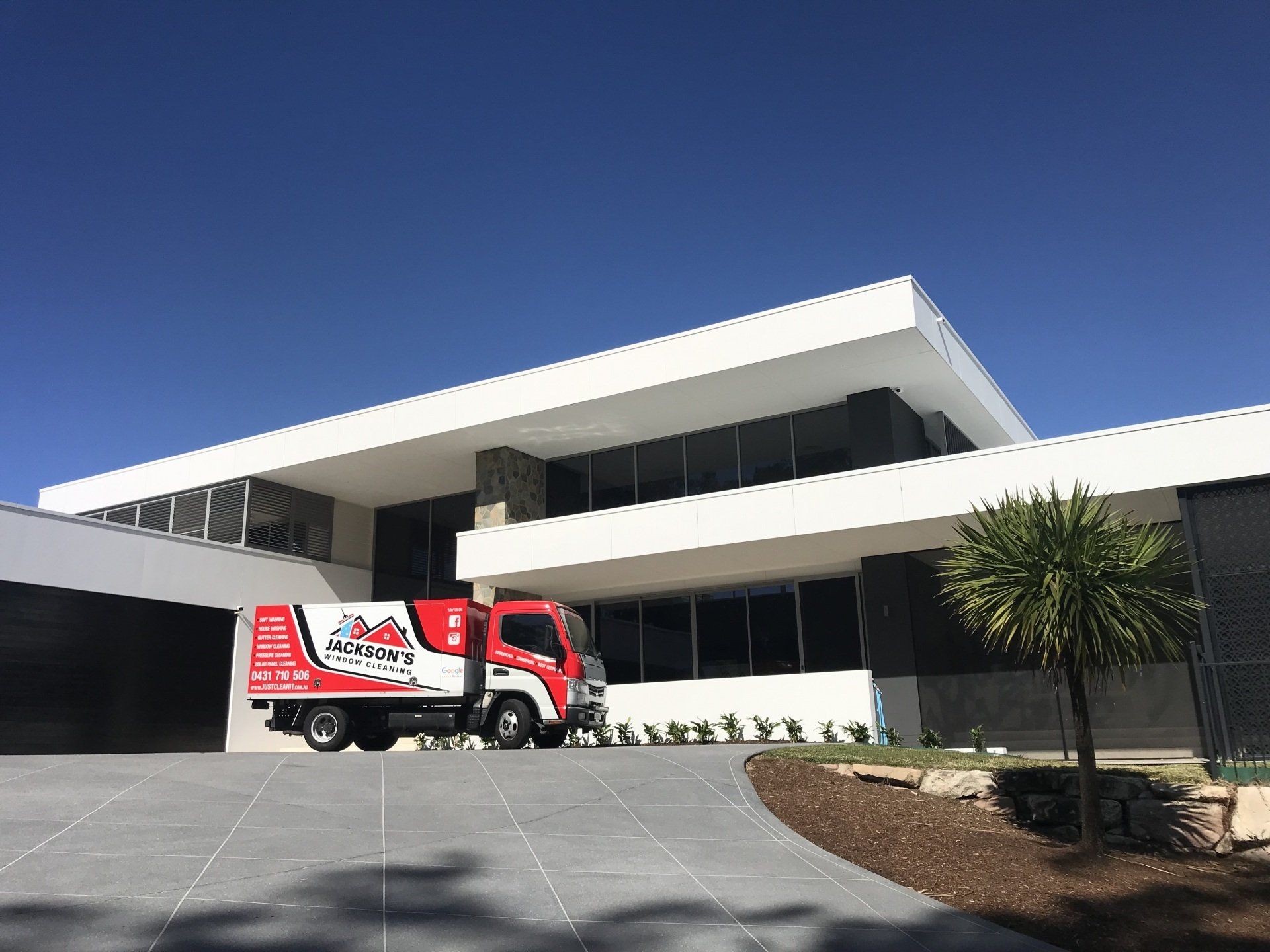 Workers Cleaning Windows — Jackson’s Window Cleaning in Nerang, QLD