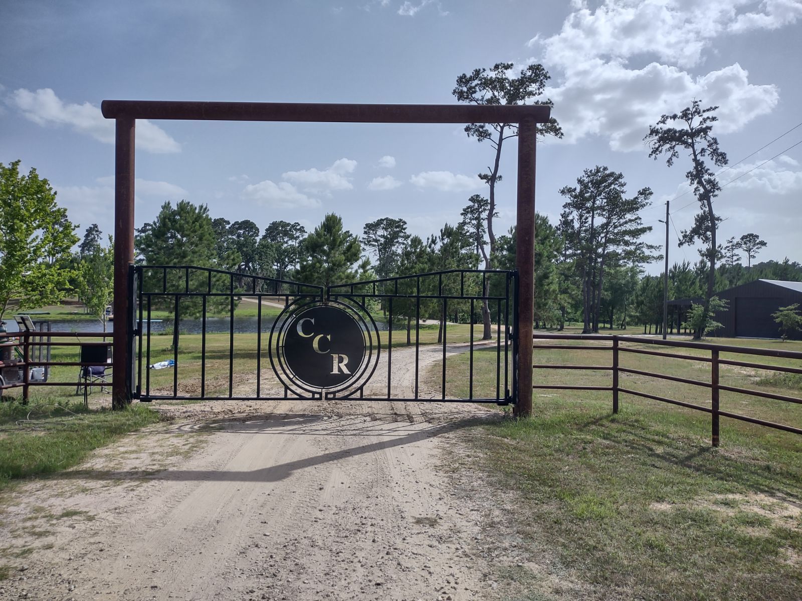 A metal gate with the letters cr on it