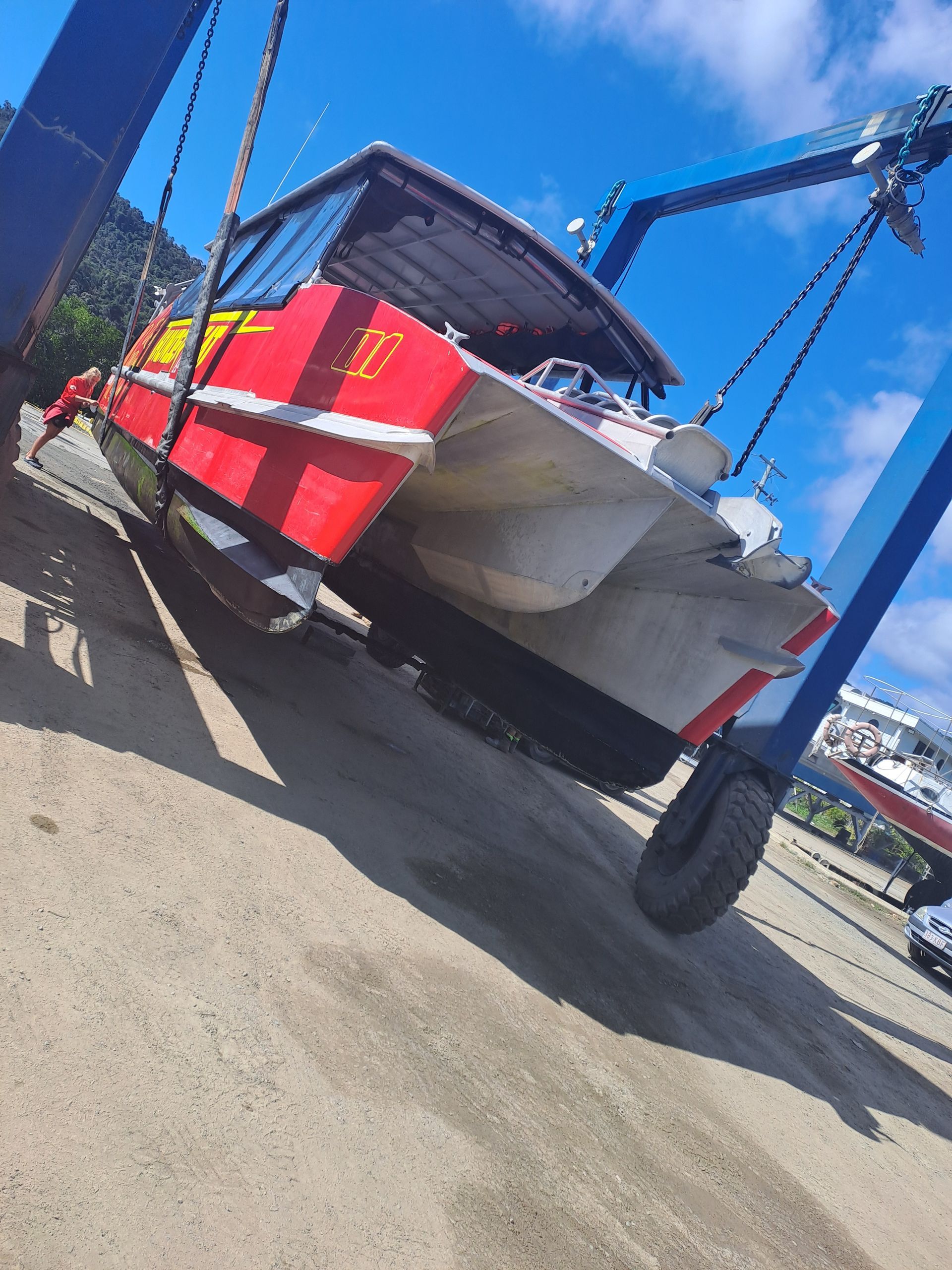 A Large White Boat Is Parked In A Parking Lot — Edge's Boatyard In Jubilee Pocket, QLD