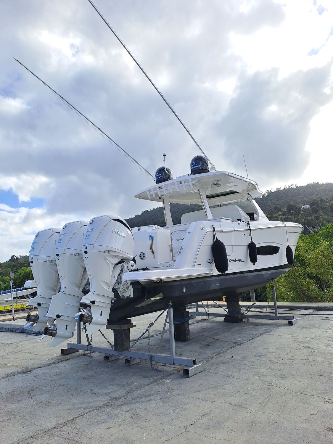A Boat In The Water By A Doc — Edge's Boatyard In Jubilee Pocket, QLD