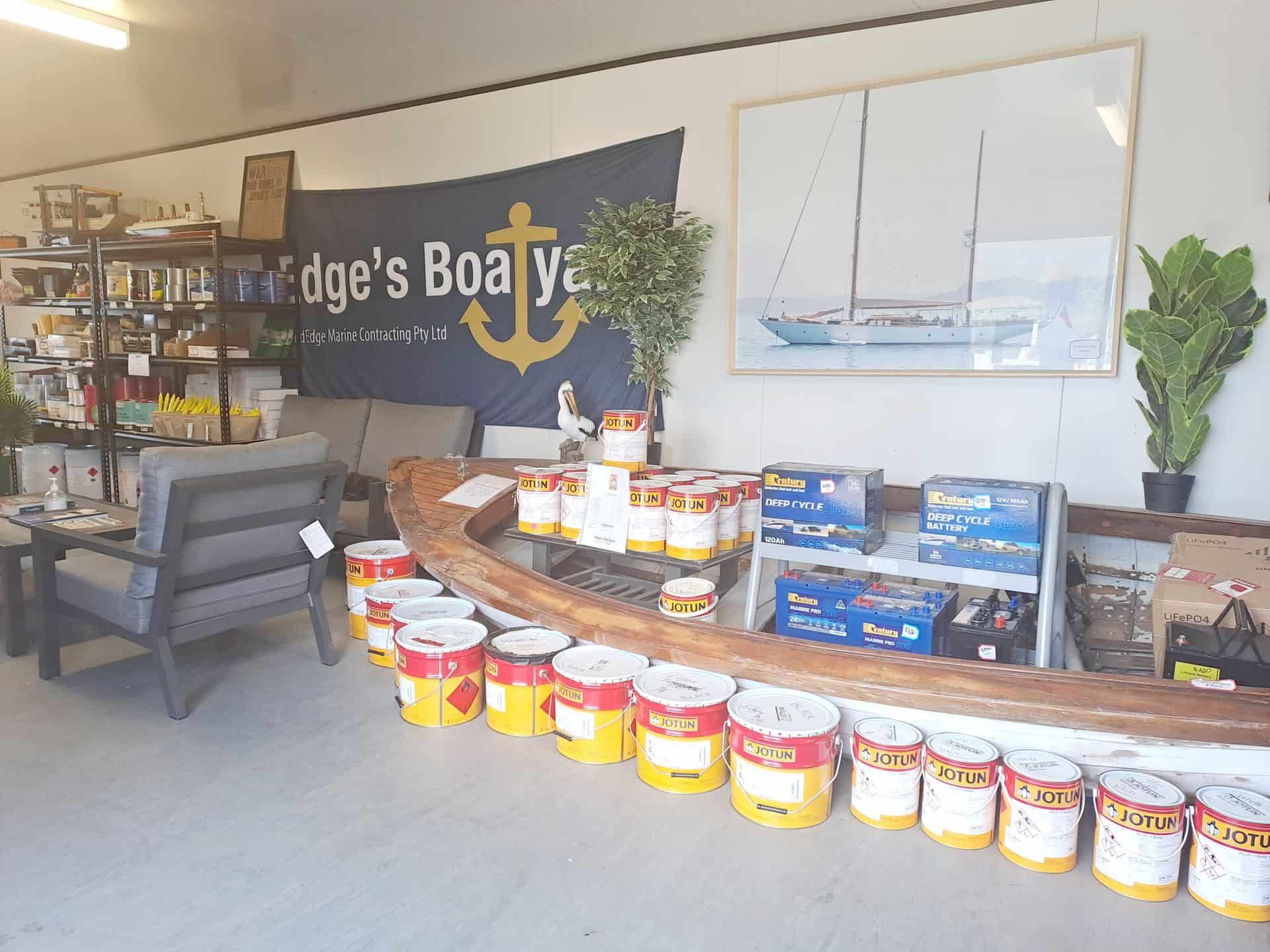 A Store Filled With Shelves Filled With Lots Of Paints — Edge's Boatyard In Jubilee Pocket, QLD