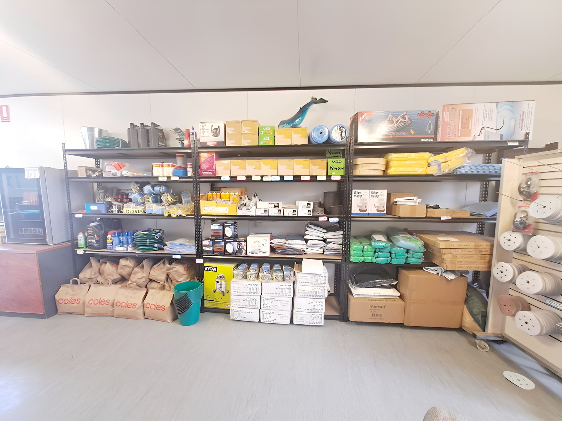 A Store Filled With Shelves Filled With Lots Of Paints — Edge's Boatyard In Jubilee Pocket, QLD