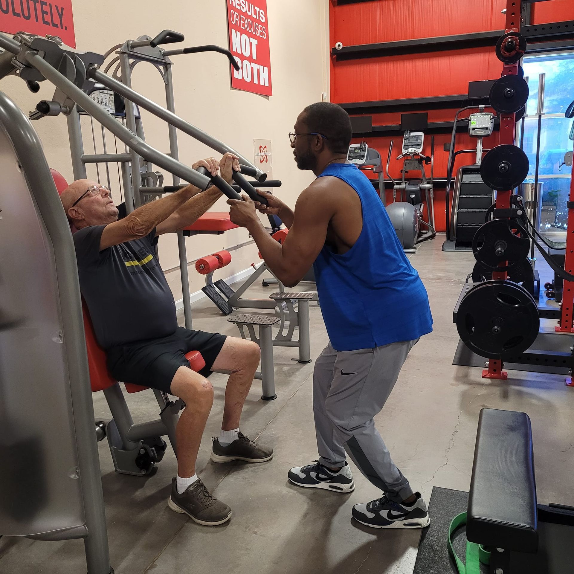 Two men are working out in a gym