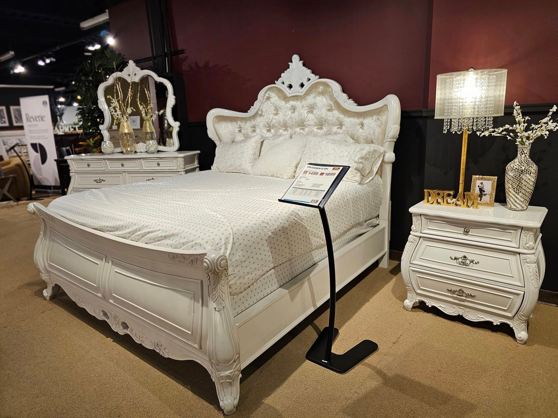 A white dining table and chairs are sitting on a rug in a dining room - Montclair, CA - Alexa Furniture