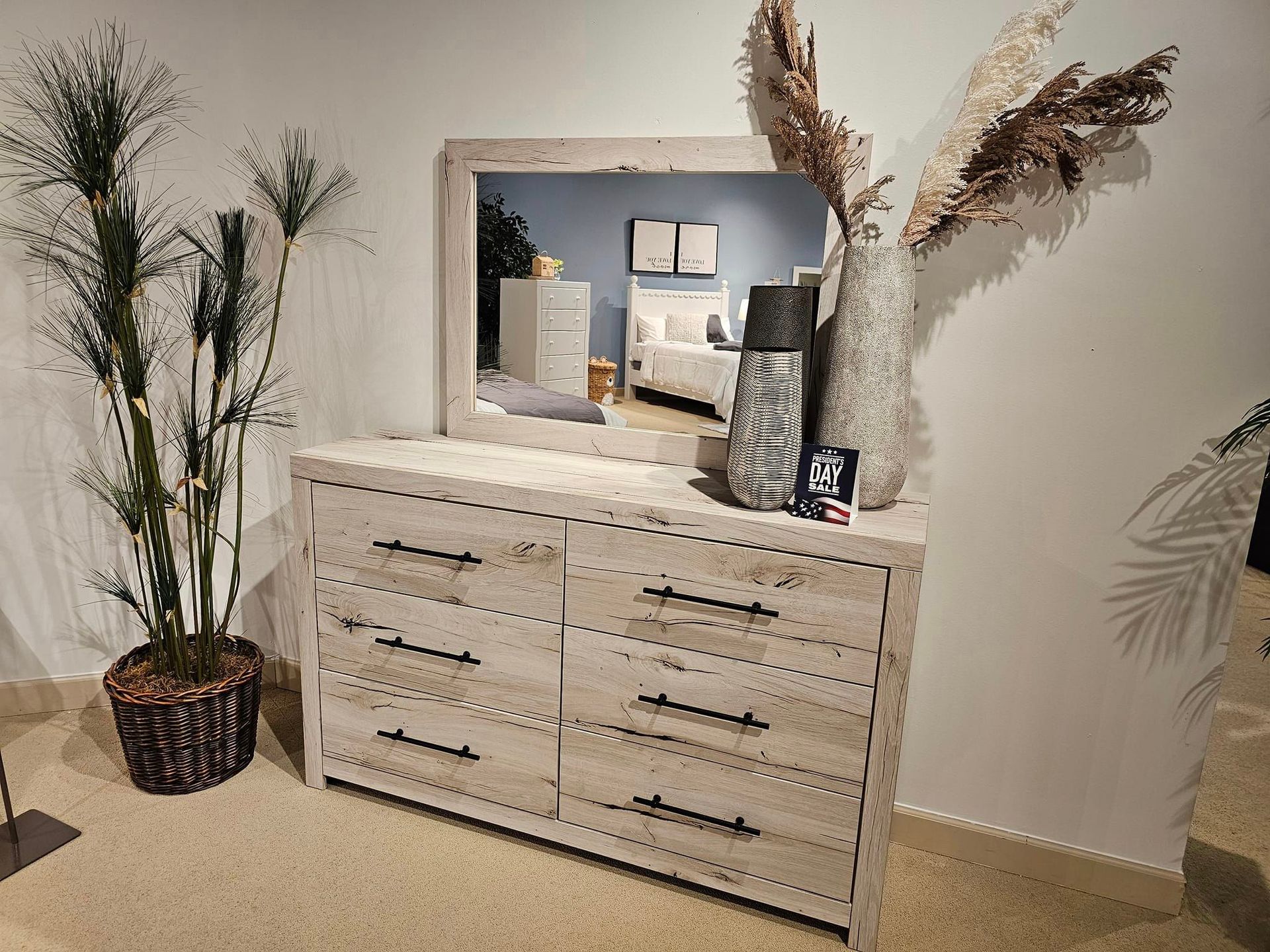 A white dining table and chairs are sitting on a rug in a dining room - Montclair, CA - Alexa Furniture