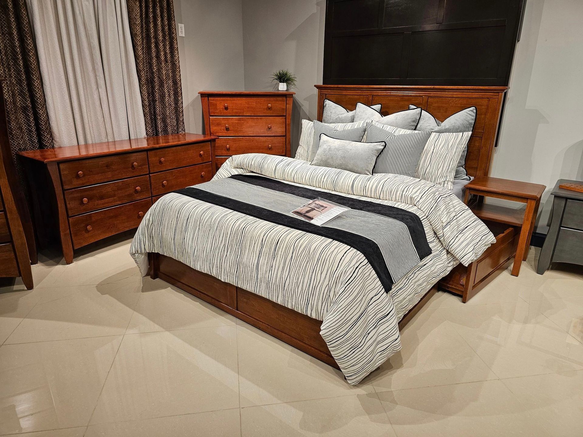 A bedroom with a bed, dresser, and chest of drawers - Montclair, CA - Alexa Furniture