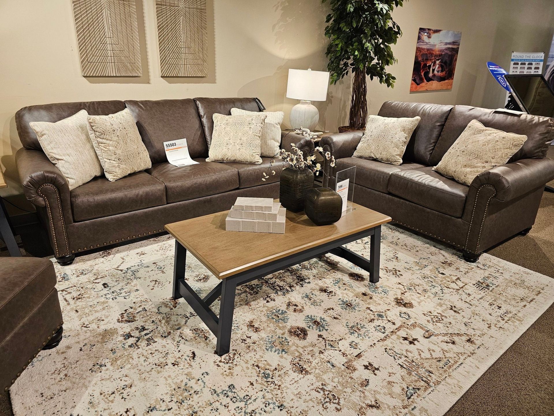 A blue couch with pillows on it is in a living room - Montclair, CA - Alexa Furniture