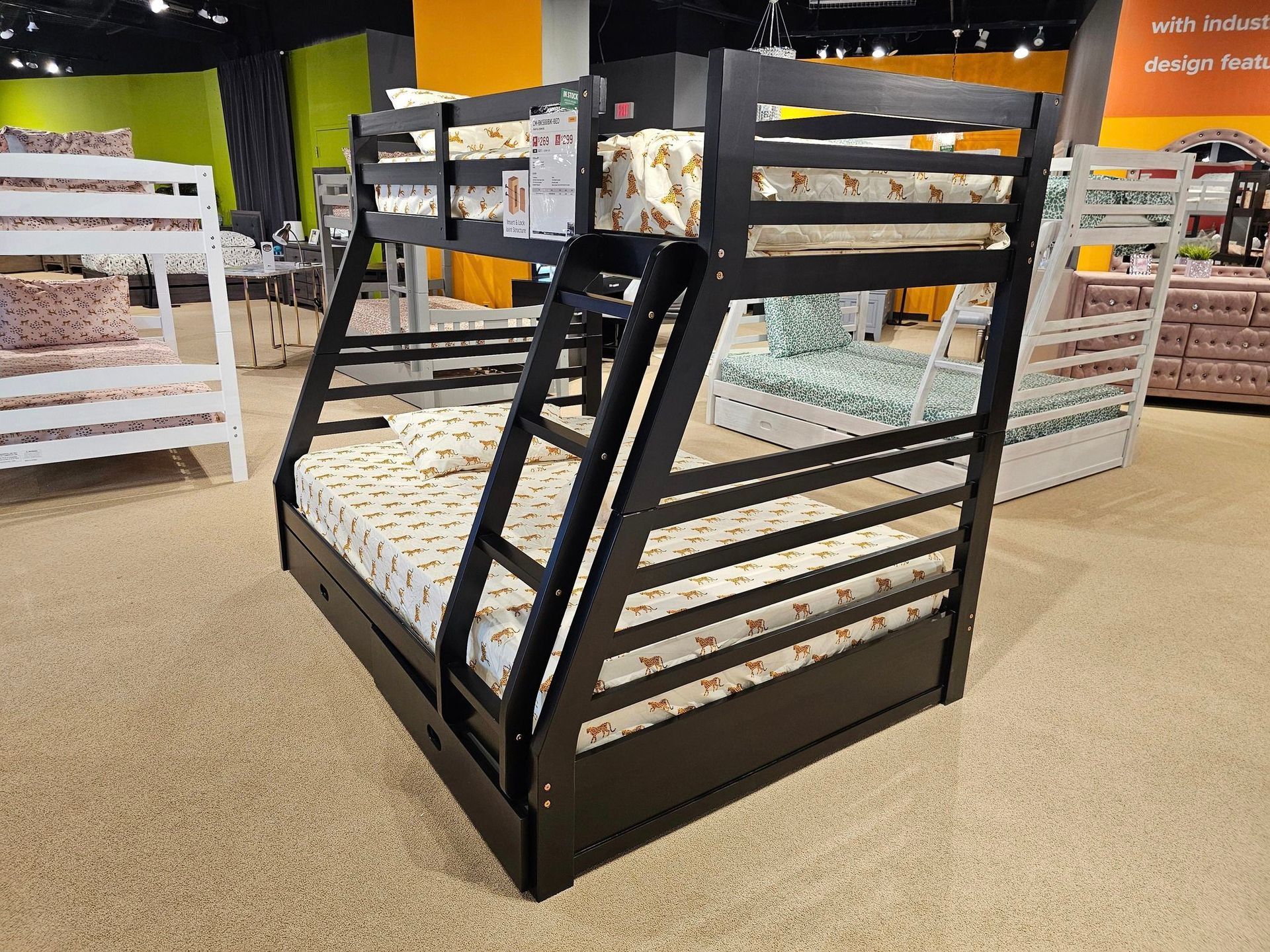 A blue couch with pillows on it is in a living room - Montclair, CA - Alexa Furniture