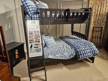 A bunk bed is sitting on top of a carpeted floor in a room - Montclair, CA - Alexa Furniture