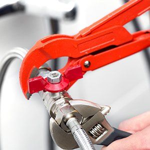 Plumber Screwing Plumbing Fittings—Water Heater Installation in Newburgh, NY