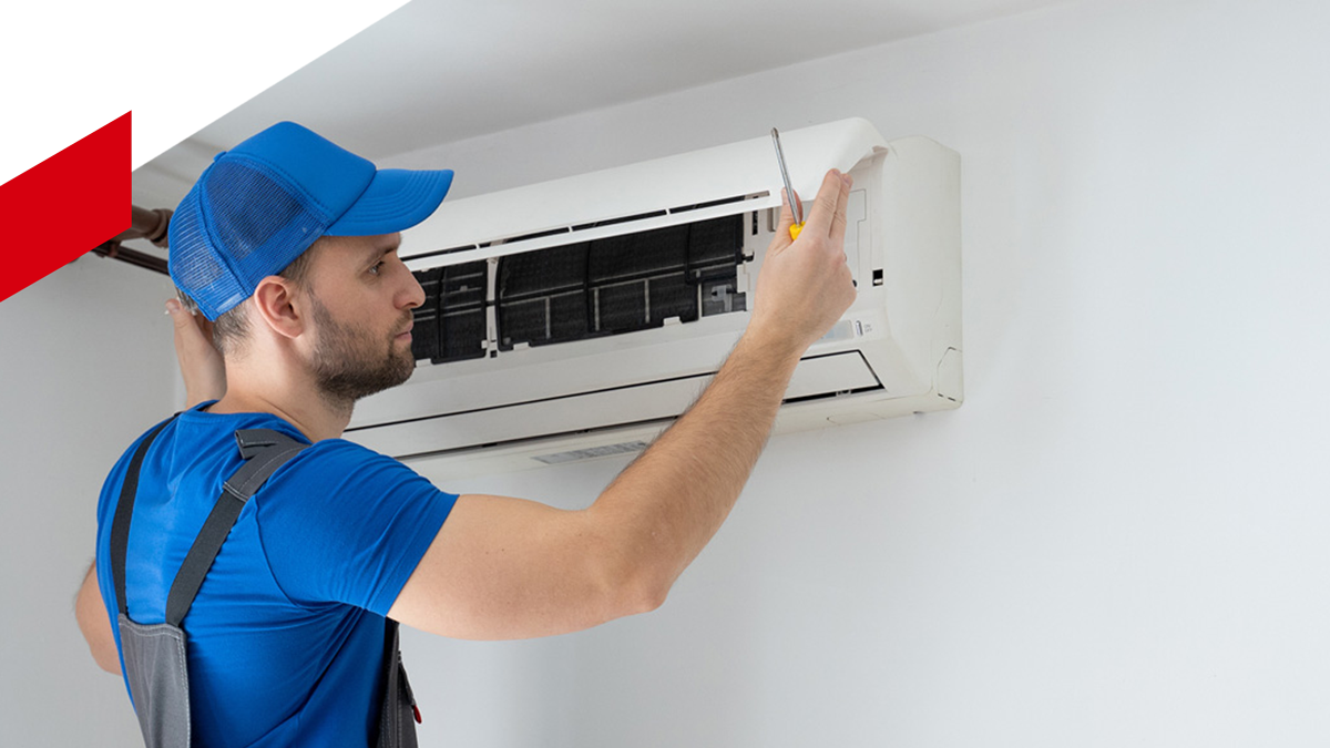 Repairs An Air Conditioner On The Wall — Woree, QLD — Air First Air Conditioning and Electrical