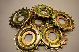 Yellow zinc plated gears by Seminole Metal Finishing.
