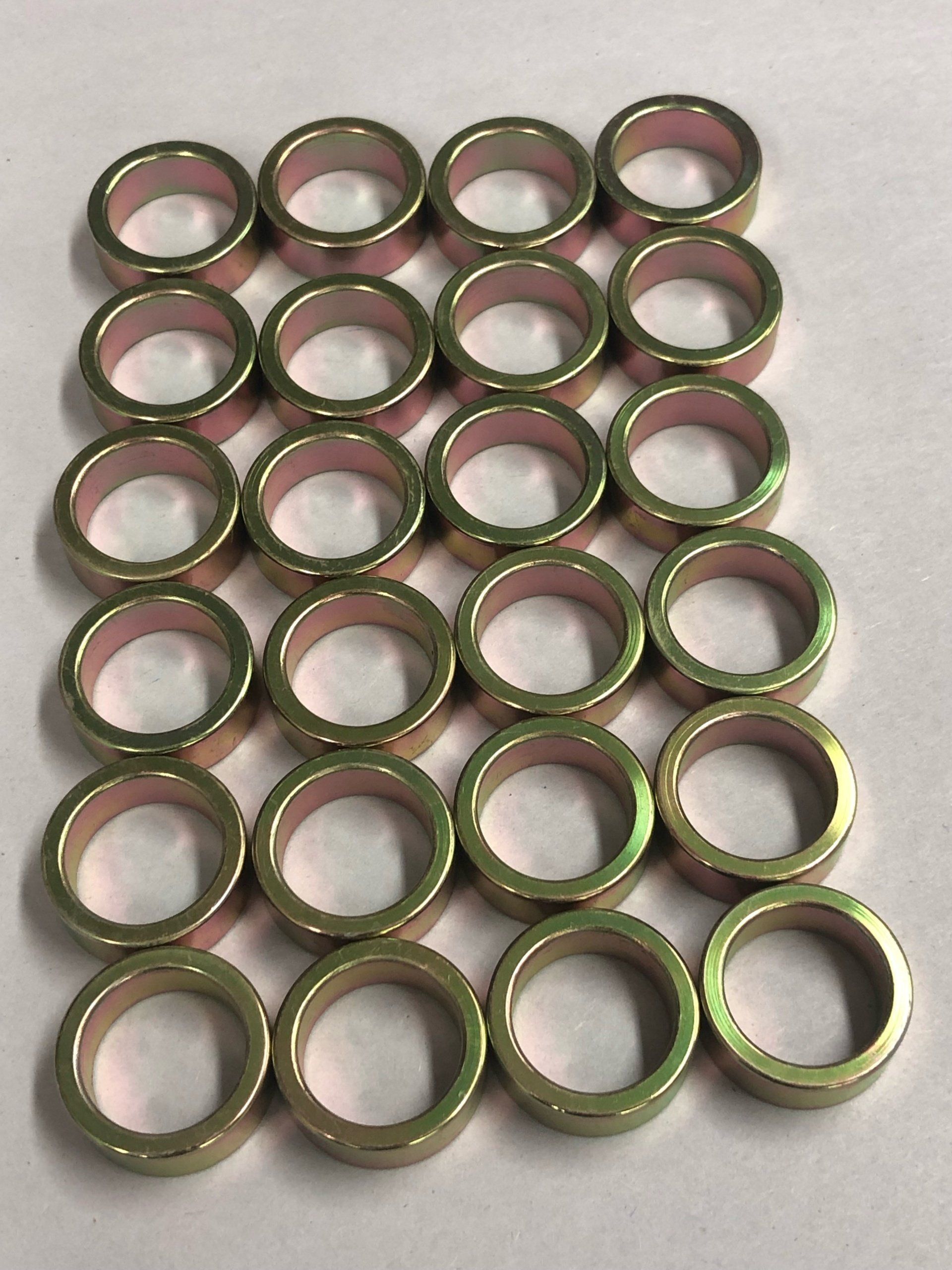 Yellow zinc plated steel spacers by Seminole Metal Finishing.