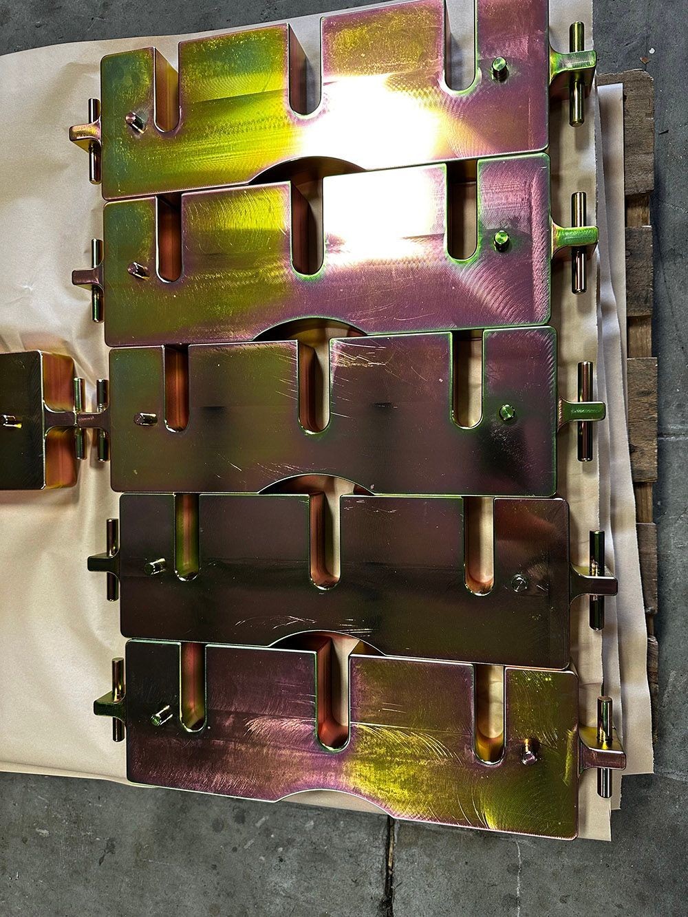 Yellow zinc plated steel weights by Seminole Metal Finishing.