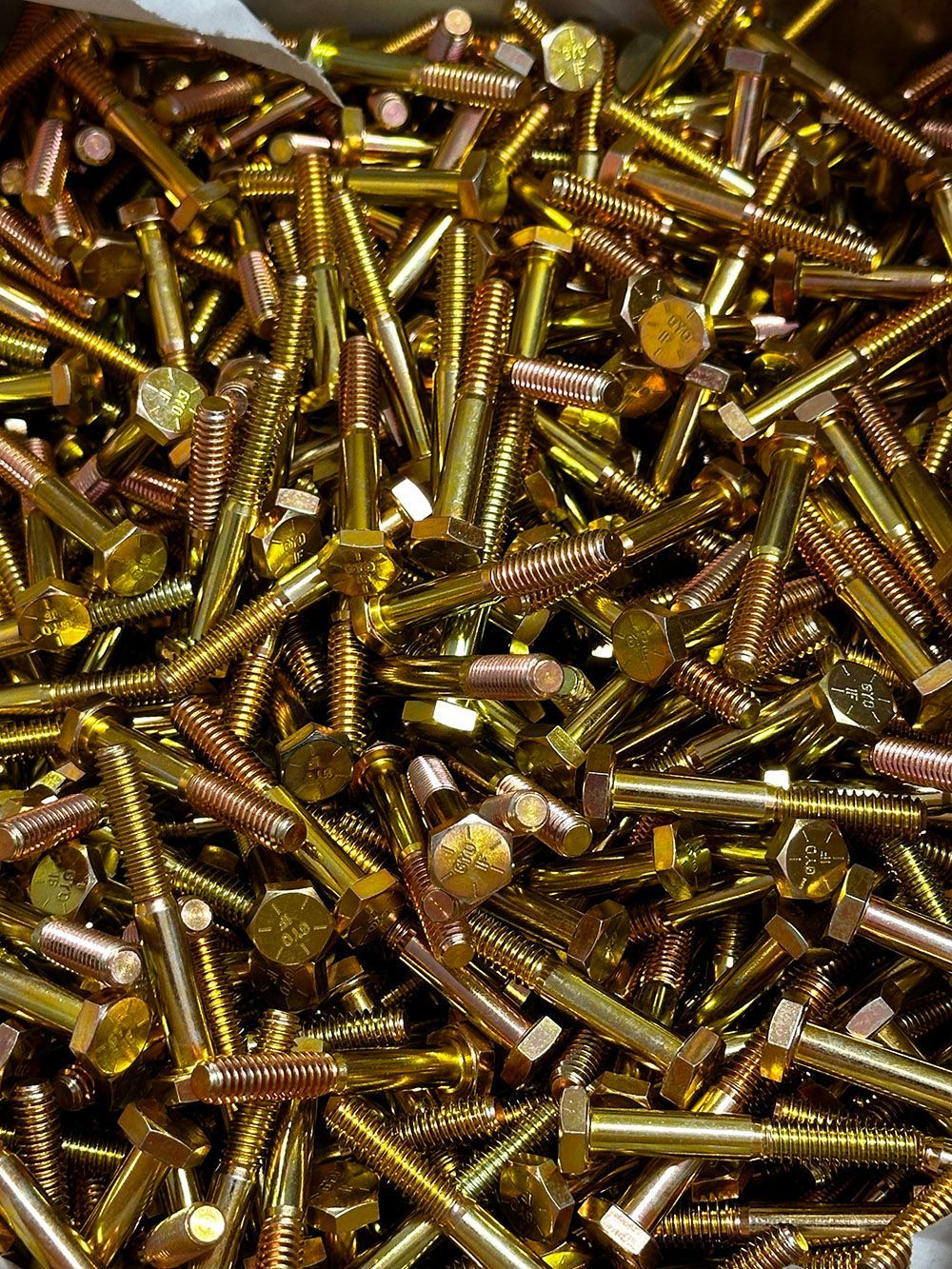 Trivalent yellow zinc plating on steel bolts by Seminole Metal Finishing.
