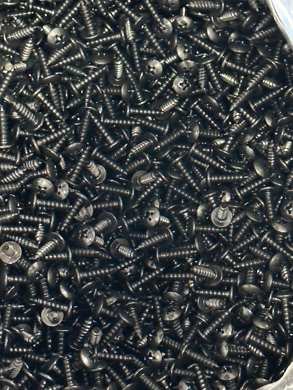 Black oxide on Stainless steel screws by Seminole Metal Finishing.