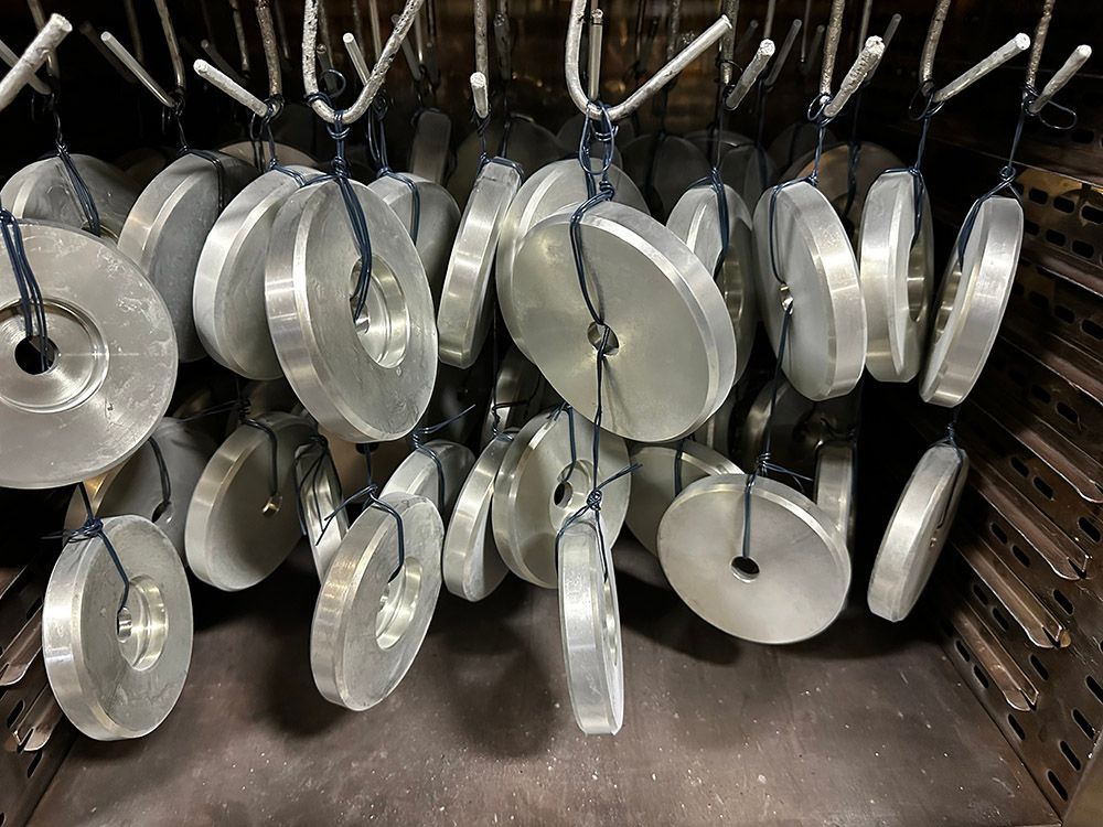 Steel discs posted baked for hydrogen embrittlement relief after zinc plating by Seminole Metal Finishing.