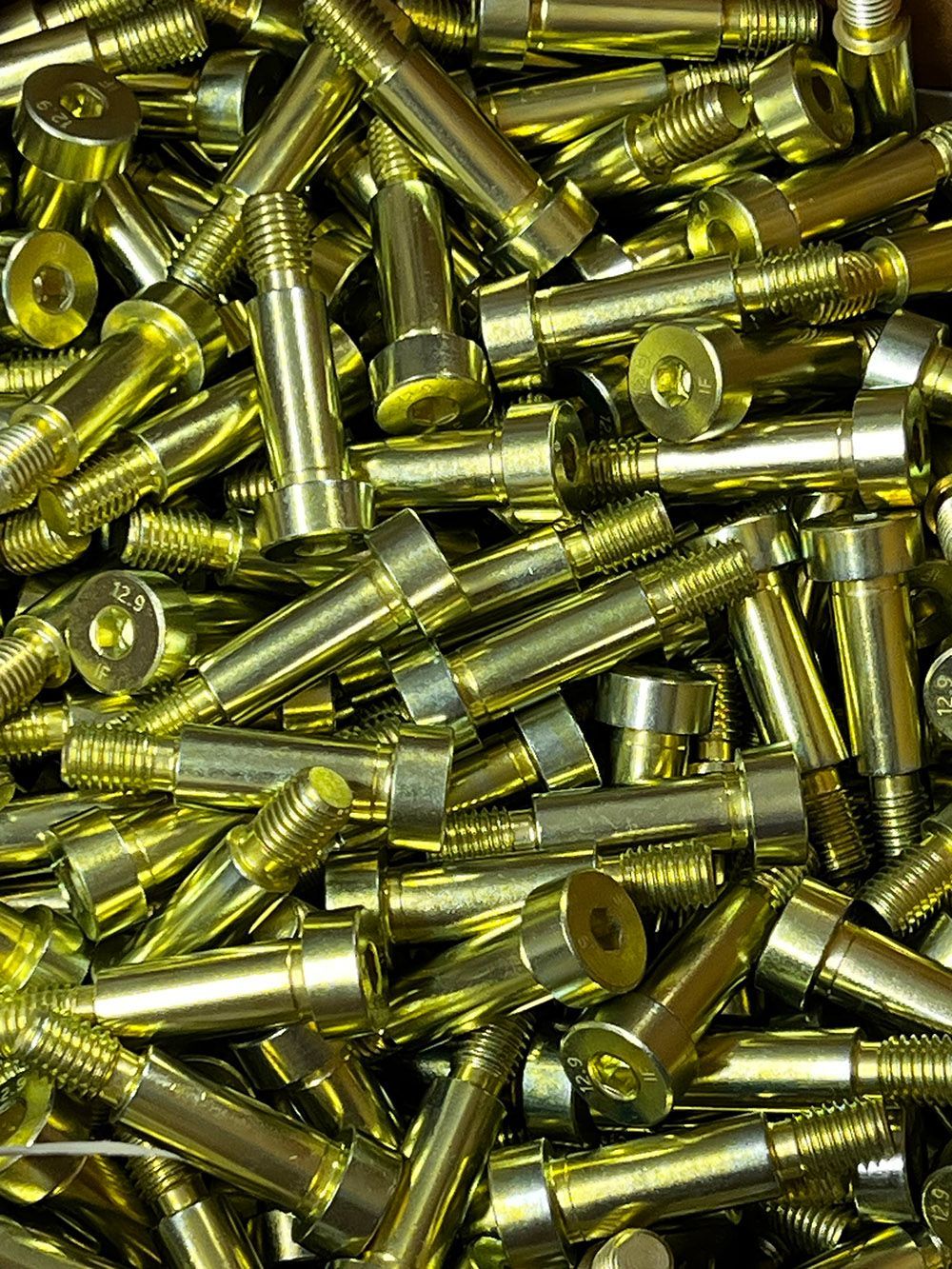 Trivalent yellow zinc plated shoulder bolts by Seminole Metal Finishing.
