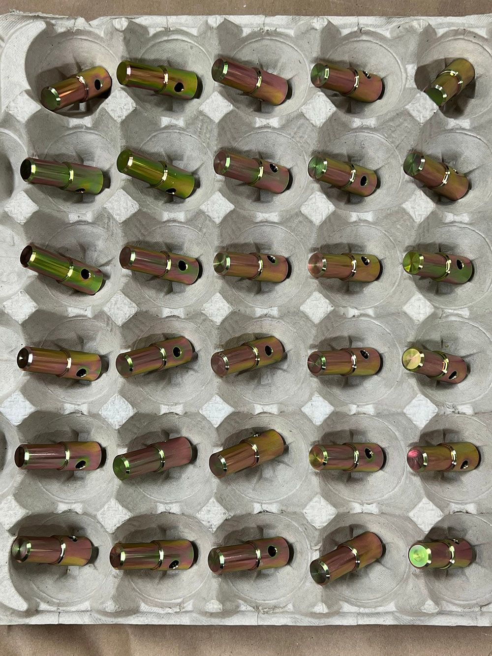 Machined steel parts yellow zinc plated by Seminole Metal Finishing.