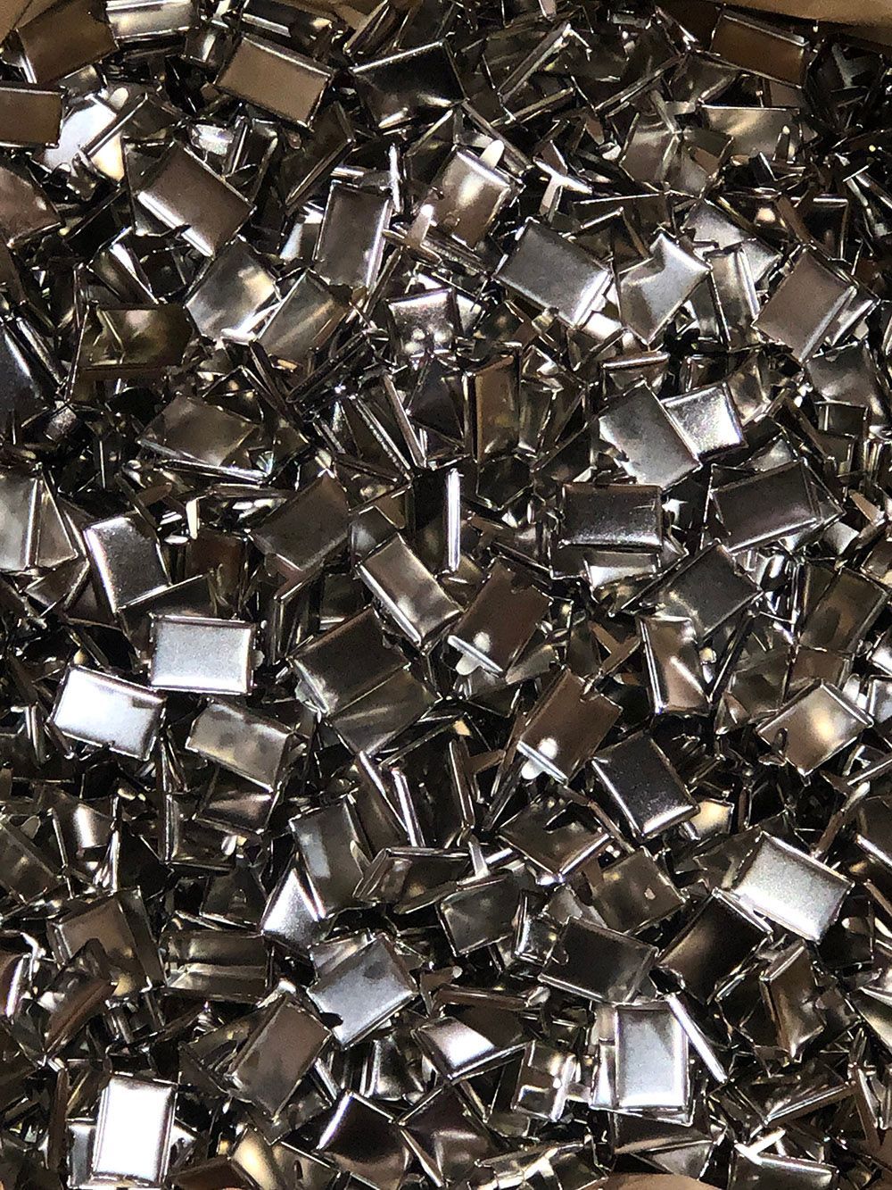 Steel decorative rivets plated with bright nickel by Seminole Metal Finishing.