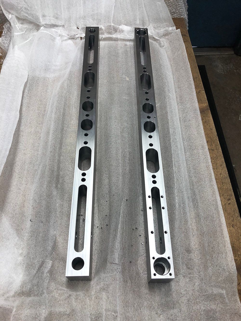 Electroless nickel plating on steel bars by Seminole Metal Finishing.